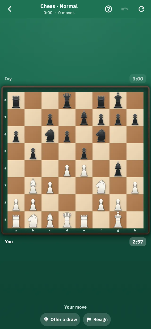 A game of chess against the computer, the pieces set out on a wooden board with the file and rank labels along the edges.