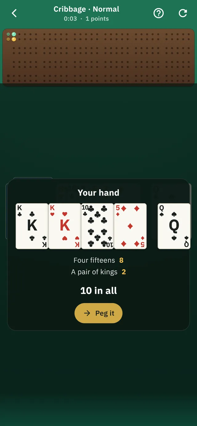 A Cribbage board mid-game, showing pegs and the current hand.
